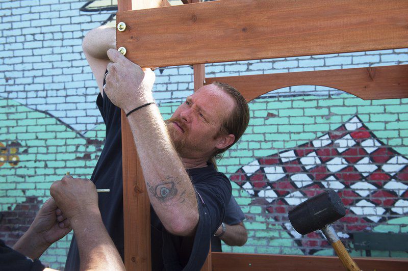 Law firm donates playground set to homeless shelter